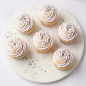 Honey Lavender Dream Cupcakes Honey Lavender Dream Cupcakes Hero plate of floral cupcakes for the recipe card