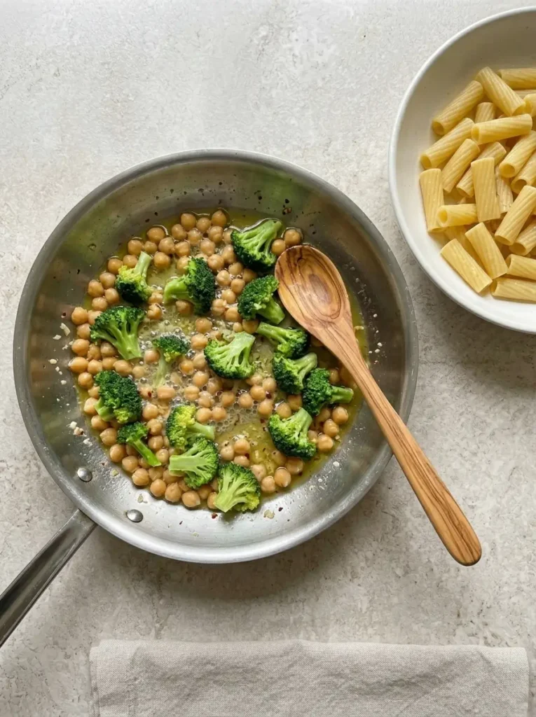 Broccoli Chickpea Pasta for a Quick Meatless Dinner Broccoli Chickpea Pasta Bright broccoli and chickpeas simmering with garlic and vegetable broth
