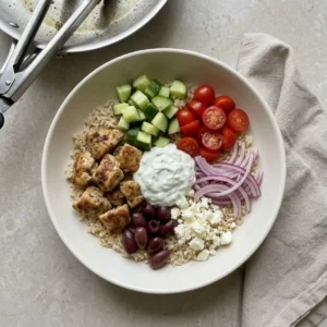 Chicken Gyro Bowls for a Fresh Mediterranean Dinner Chicken Gyro Bowls Chicken Gyro Bowls with rice, lemon-herb chicken, cucumber, tomatoes, olives, feta, and tzatziki
